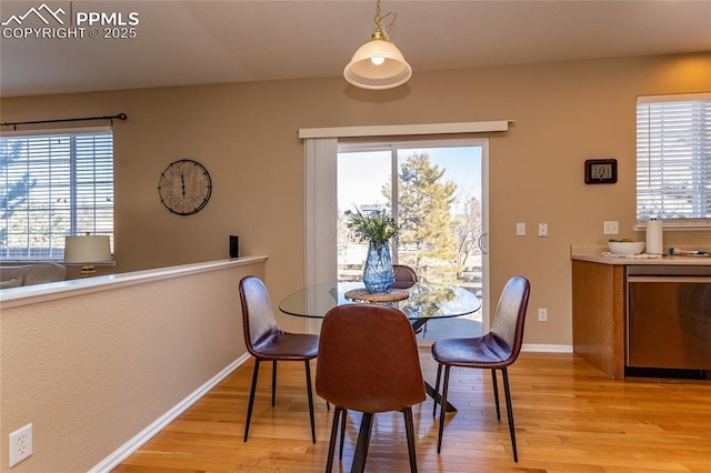 dining area with plenty of natural light and light wood-type flooring