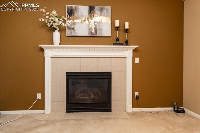 interior details featuring carpet flooring and a tile fireplace