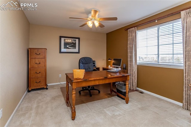 carpeted home office with ceiling fan