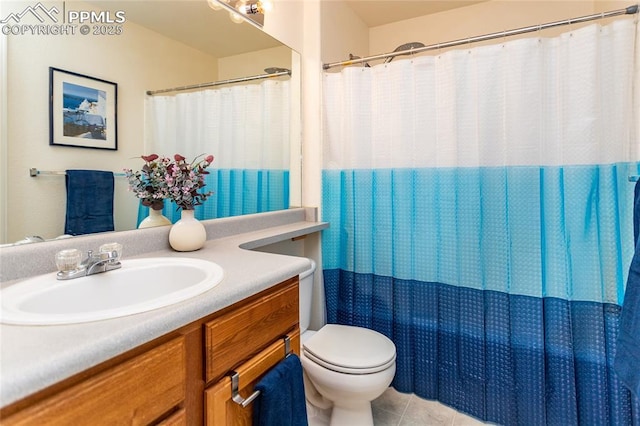 bathroom featuring toilet, vanity, tile patterned floors, and curtained shower