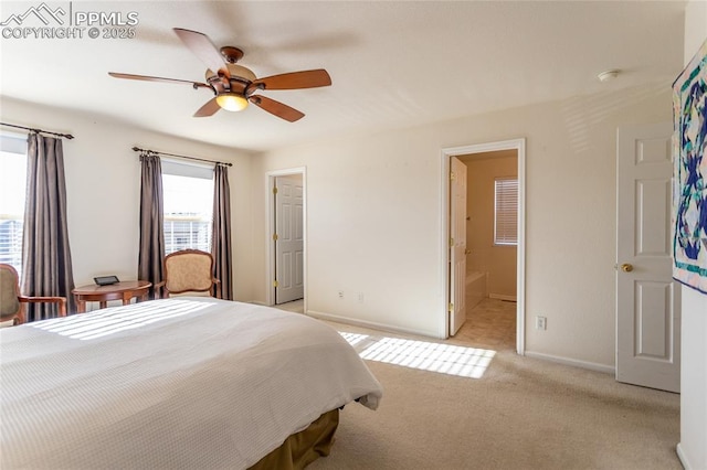 carpeted bedroom with ceiling fan and connected bathroom