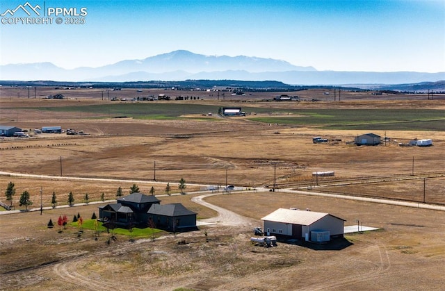 bird's eye view with a rural view and a mountain view