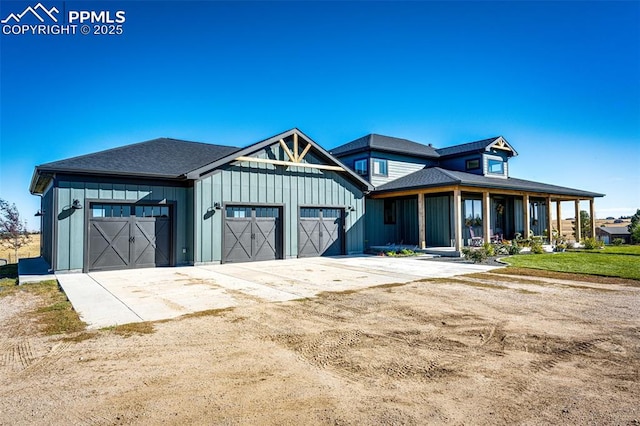 view of front of house with a garage and a porch