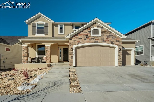 craftsman house featuring an attached garage, covered porch, concrete driveway, and stucco siding