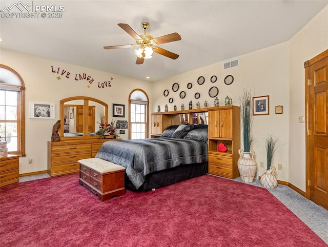 bedroom with ceiling fan and carpet