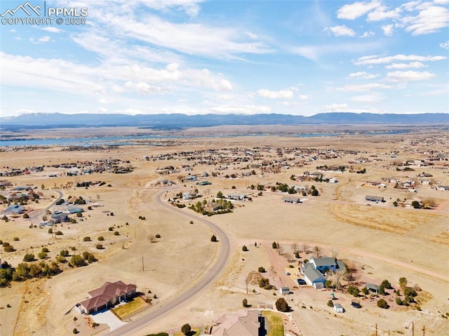 drone / aerial view featuring a mountain view