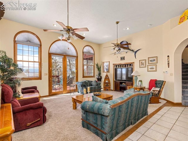 living room with light tile patterned flooring and ceiling fan