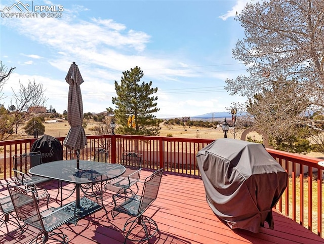 wooden terrace with area for grilling