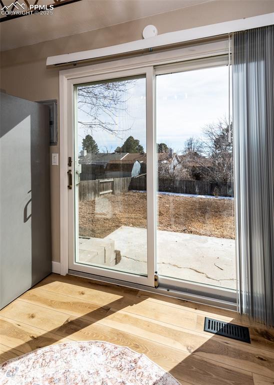 doorway to outside featuring hardwood / wood-style flooring