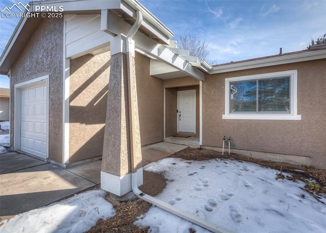 property entrance with a garage