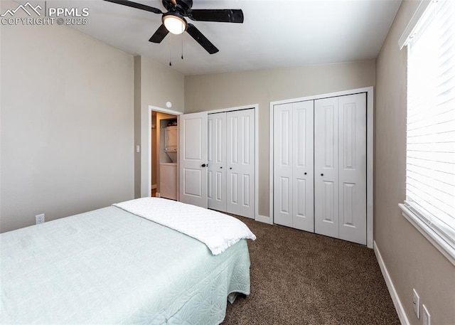 bedroom featuring ceiling fan, multiple closets, dark colored carpet, and vaulted ceiling