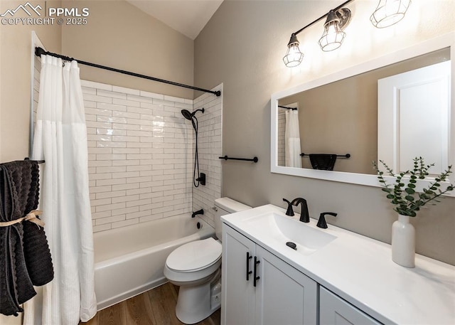 full bathroom featuring toilet, hardwood / wood-style flooring, vanity, and shower / tub combo with curtain