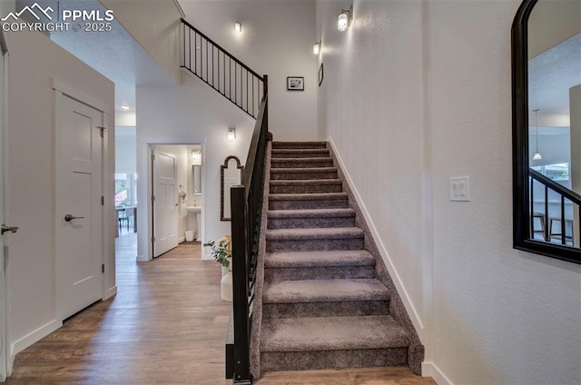 stairway featuring hardwood / wood-style flooring