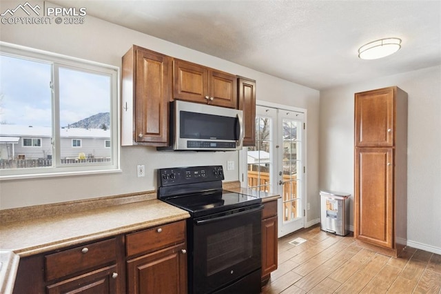 kitchen featuring a mountain view and electric range