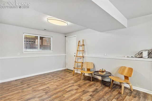 living area with hardwood / wood-style floors