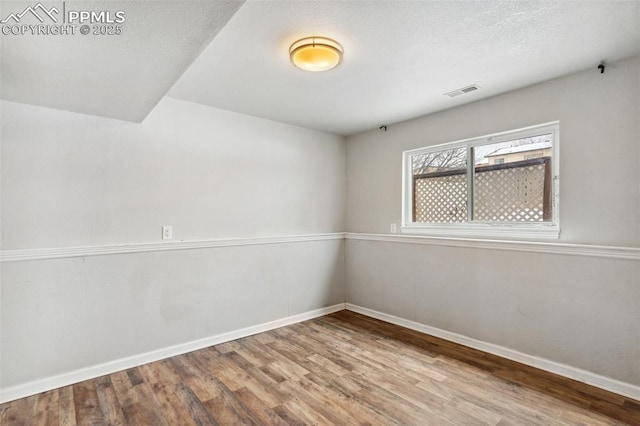 empty room featuring hardwood / wood-style floors