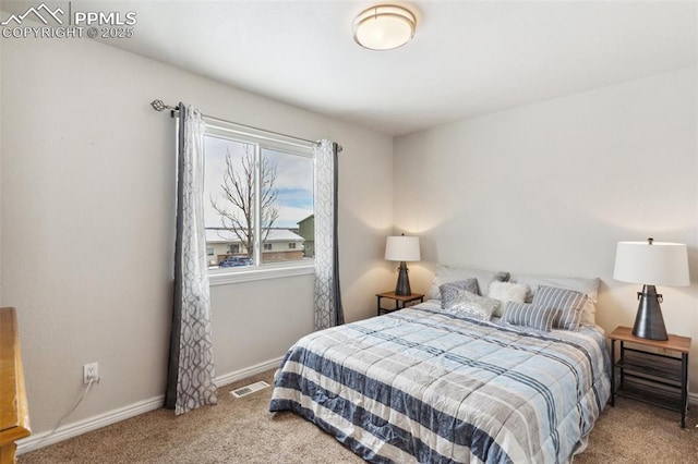 bedroom featuring light carpet