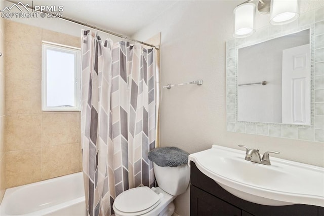 full bathroom featuring vanity, toilet, and shower / bath combo with shower curtain