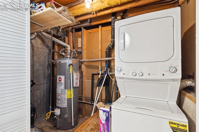 laundry area with stacked washer / drying machine and gas water heater