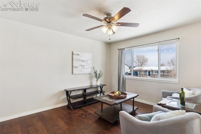 living room with ceiling fan and dark hardwood / wood-style flooring