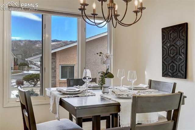 dining area with an inviting chandelier and plenty of natural light