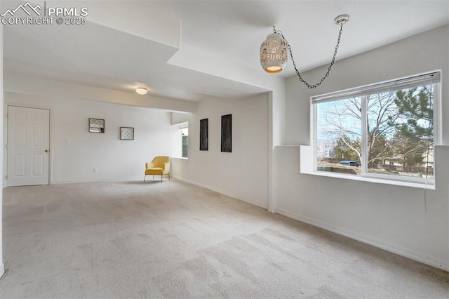 empty room with light colored carpet