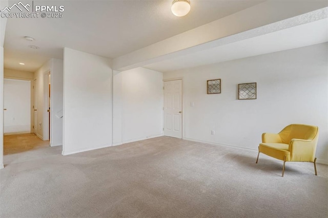 unfurnished room featuring light carpet