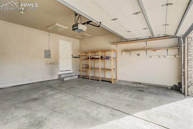 garage featuring a garage door opener and electric panel