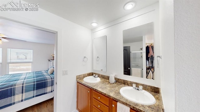 bathroom featuring vanity, ceiling fan, and hardwood / wood-style floors