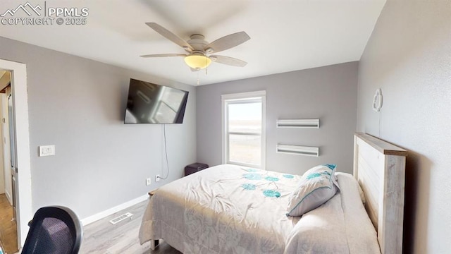 bedroom with ceiling fan and light hardwood / wood-style floors