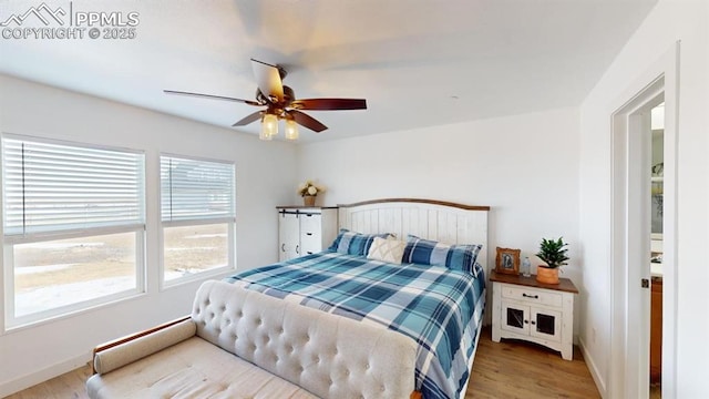 bedroom featuring ceiling fan and light hardwood / wood-style flooring