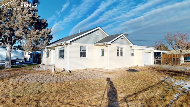 view of home's exterior with a lawn