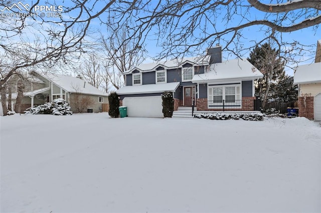 view of front of property with a garage and a porch