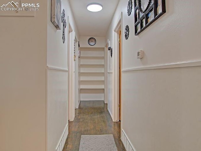 hall with dark hardwood / wood-style flooring