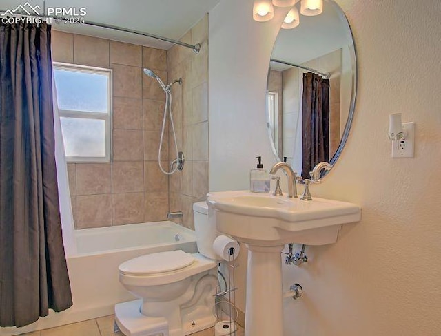 bathroom featuring shower / bath combo with shower curtain, toilet, and tile patterned flooring