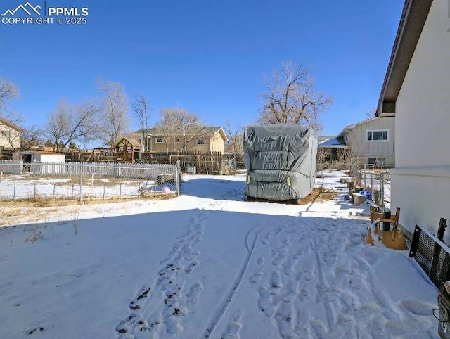 view of yard layered in snow