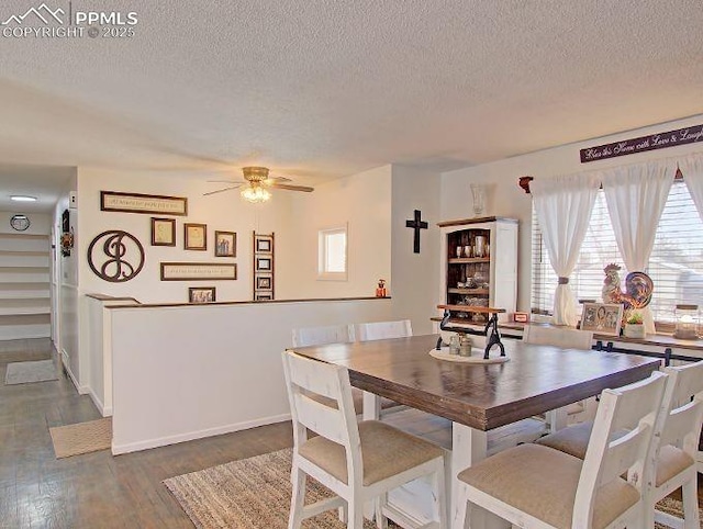 dining room with a textured ceiling, dark wood-type flooring, and ceiling fan