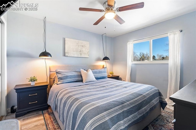 bedroom with light wood-type flooring and ceiling fan