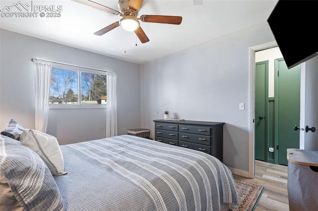 bedroom with ceiling fan and light wood-type flooring