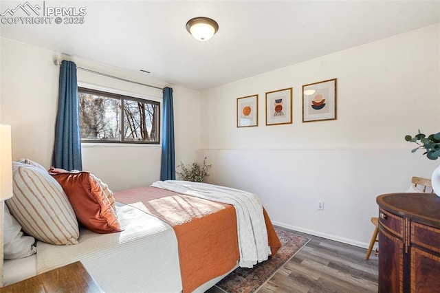 bedroom featuring dark hardwood / wood-style flooring