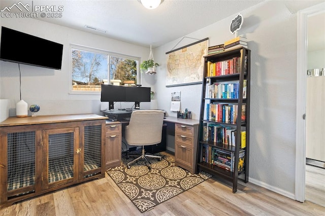 office space with light hardwood / wood-style floors