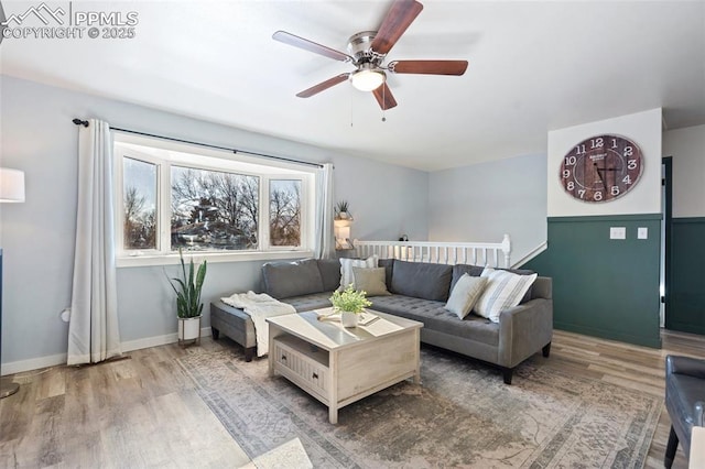 living room with hardwood / wood-style flooring and ceiling fan