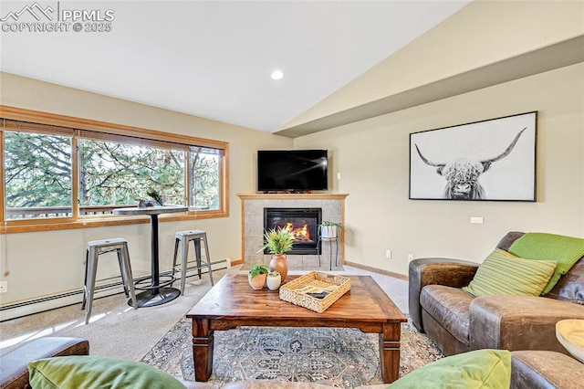 living room featuring light colored carpet, a baseboard radiator, lofted ceiling, and a tiled fireplace