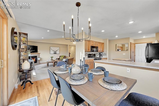 dining space with light hardwood / wood-style floors