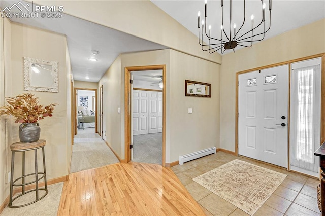 entryway featuring a baseboard heating unit and wood-type flooring