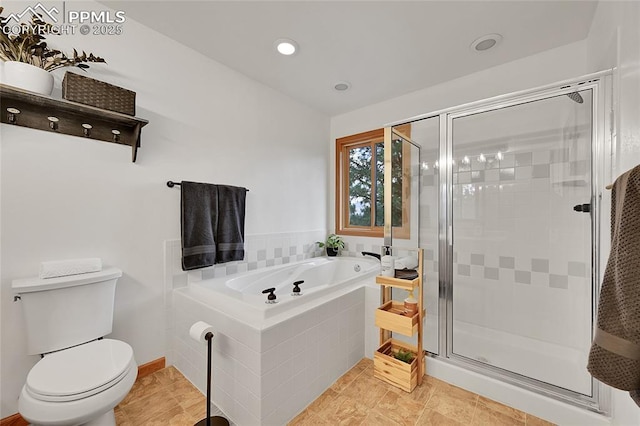 bathroom featuring toilet, tile patterned flooring, and separate shower and tub