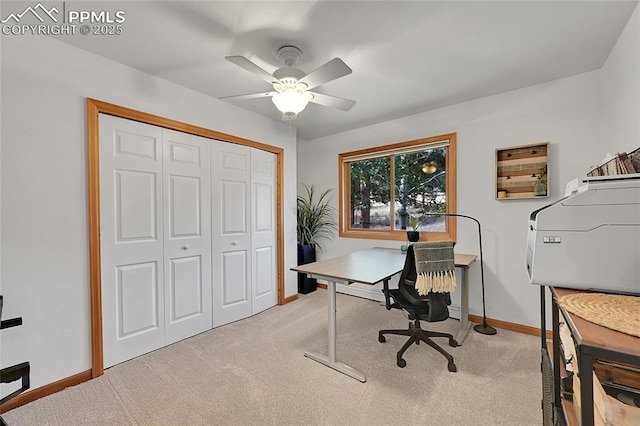 home office featuring ceiling fan and light colored carpet