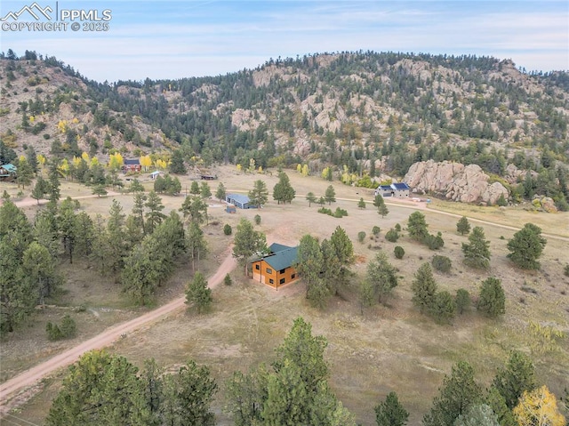 birds eye view of property with a rural view