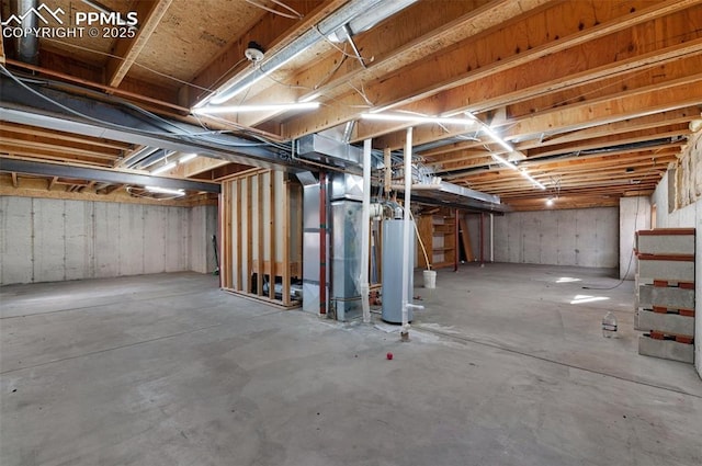 basement featuring heating unit and water heater