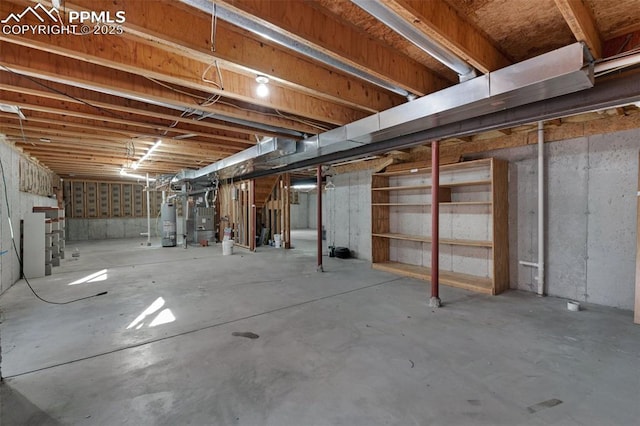 basement featuring gas water heater